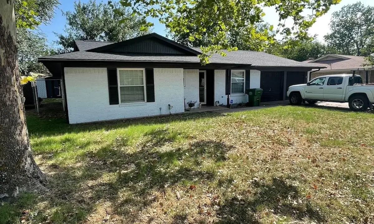 Professional roofing crew working on a residential roof in Little Elm